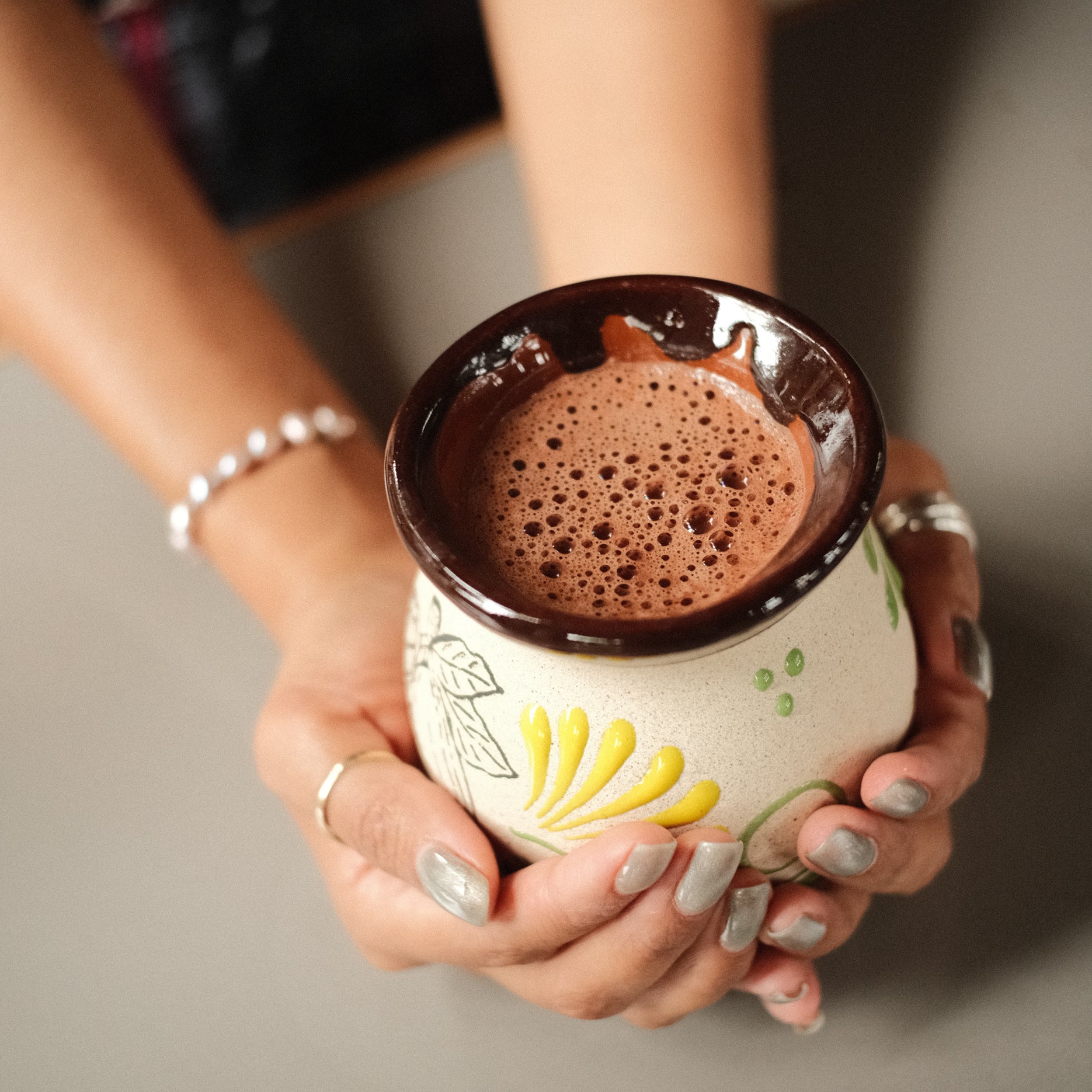 Fresh cacao drink prepared with molinillo and ceramic cup, molinillo de chocolate, cocoa mixer, ceremonial cacao tool