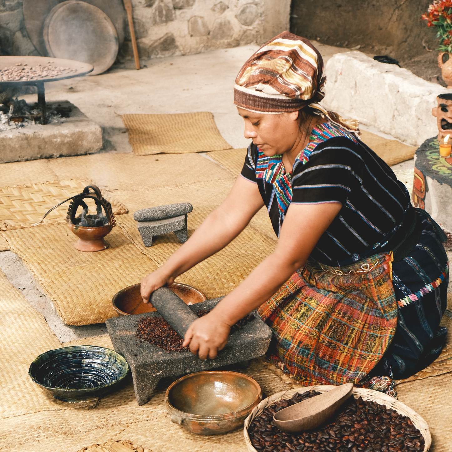 Fire-roasting cacao nibs on a comal ancestral Mayan cacao preparation in San Marcos, 100% dark chocolate, cocoa