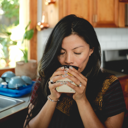 Mindful moment with vegan Golden Milk calming adaptogenic drink made with organic spices for holistic health